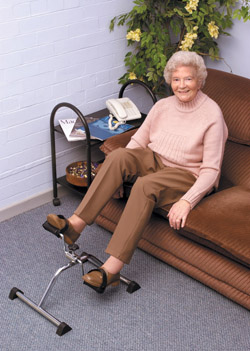 Woman pedalling while sitting on a couch